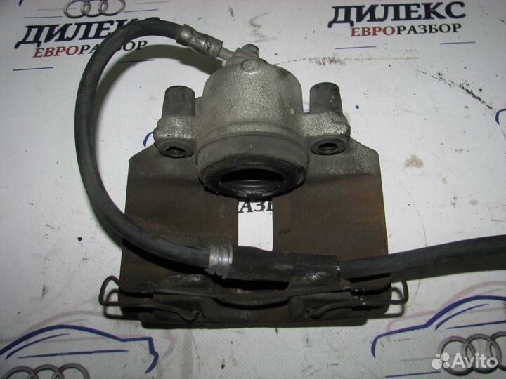 Суппорт передний левый VW Passat (B6) 2005-2010