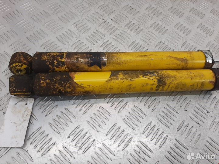 Амортизатор задний левый Ford Focus рест. 2003