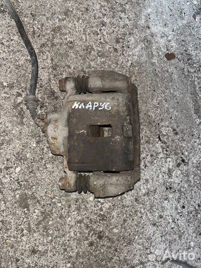 Суппорт передний левый Kia Clarus