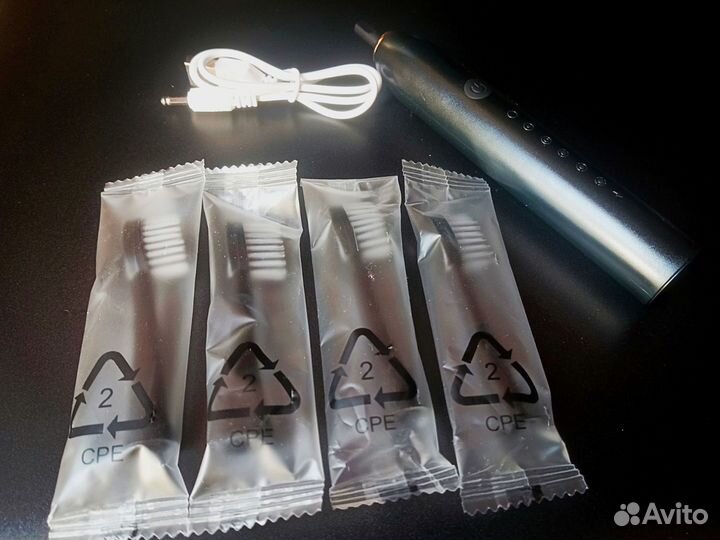 Электрическая зубная щетка