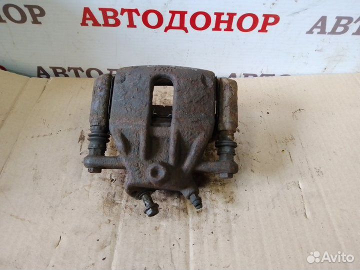 Суппорт тормозной передний правый Nissan Note E11