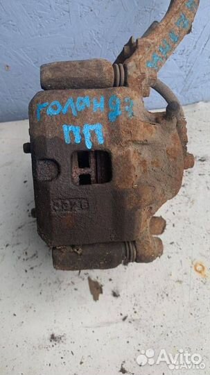 Суппорт тормозной передний Mitsubishi Galant 7