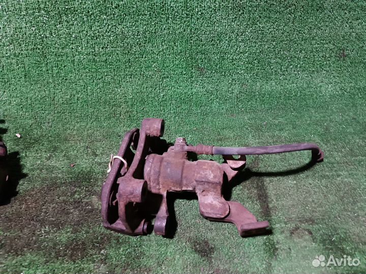 Суппорт тормозной задний левый Mazda 6