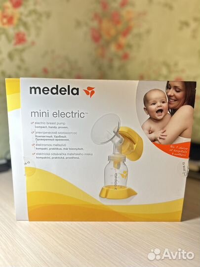 Молокоотсос medela электрический