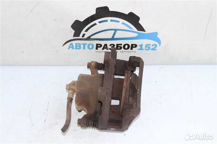 Суппорт тормозной передний левый Nissan Primera