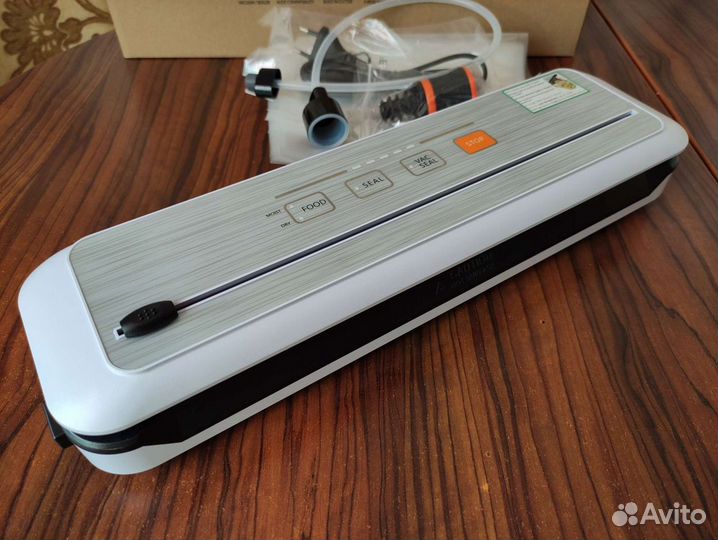 Вакуумный упаковщик новый
