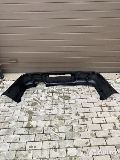 Бампер задний на mazda 323