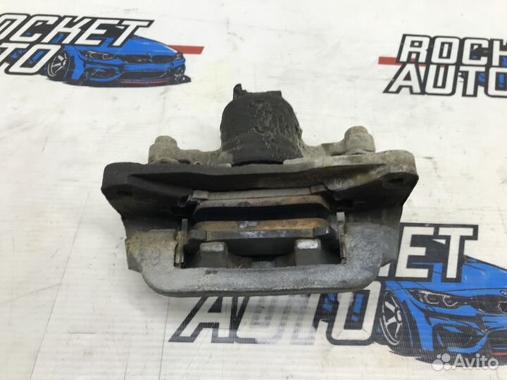 Суппорт тормозной задний левый Subaru Forester SG