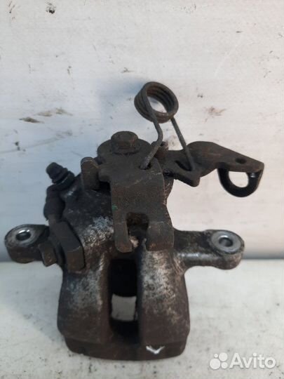 Суппорт тормозной задний левый Opel Astra