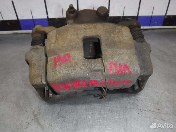 Суппорт передний левый Mitsubishi Pajero Sport 2