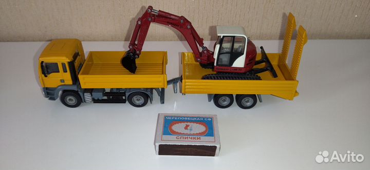 Модель грузовик Man с экскаватором Schaeff, Siku