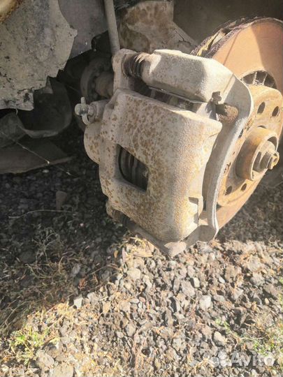 Передний левый тормозной суппорт Дэу Нексия Daewoo