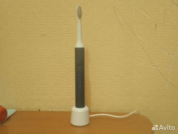 Электрическая зубная щетка