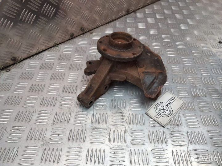 Кулак поворотный левый Fiat Doblo 1.3