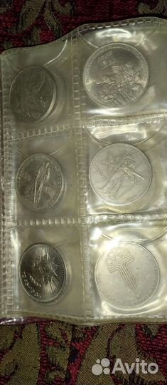 Два альбома с монетами разных времён и эпох