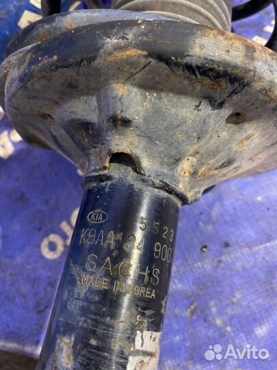 Передняя левая стойка амортизатора Kia Clarus