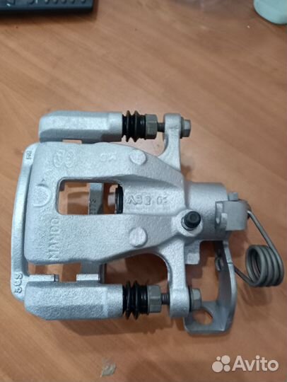 Суппорт тормозной задний kia rio 3,Солярис