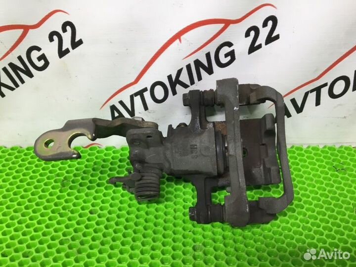 Суппорт тормозной задний правый Nissan Primera