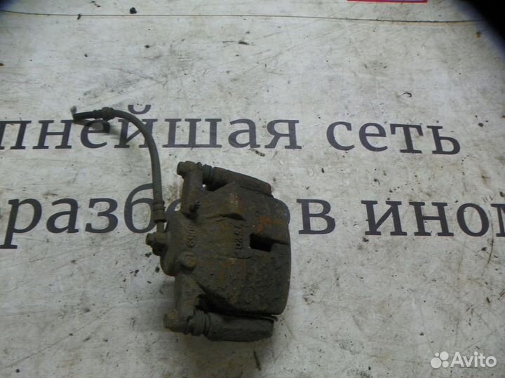 Суппорт тормозной передний левый Nissan Qashqai