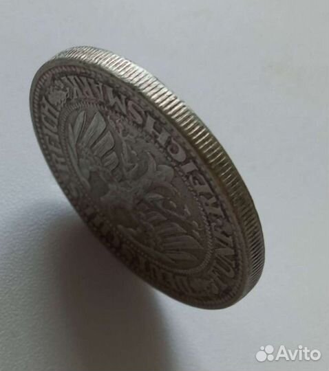 Монета серебряная