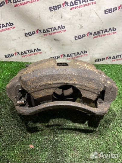 Суппорт тормозной передний правый Toyota Carina E