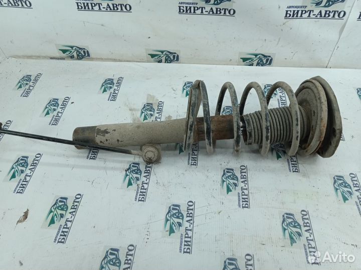 Стойка амортизатора передняя левая Peugeot 206