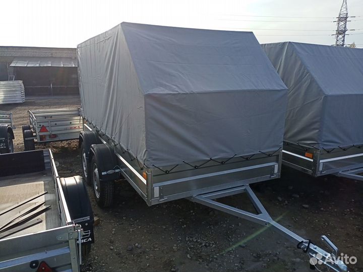 Двухосный легковой автоприцеп со скошенным тентом