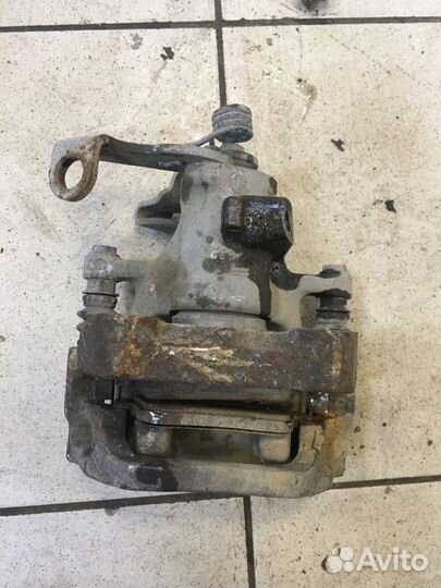 Суппорт тормозной задний левый Peugeot 308