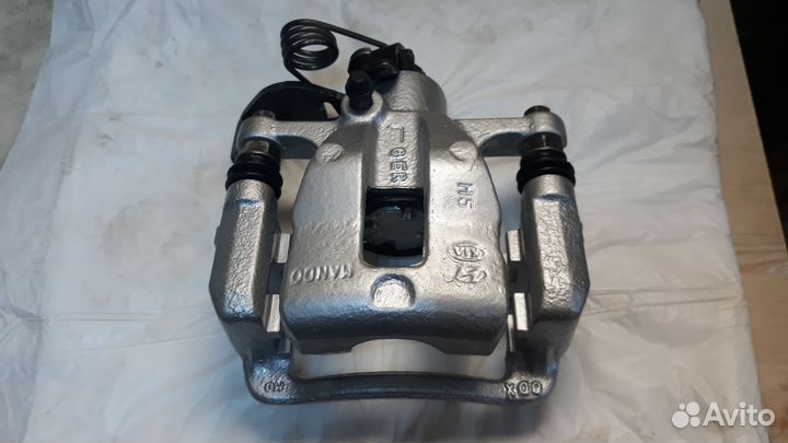 Суппорт задний левый Kia Rio 3