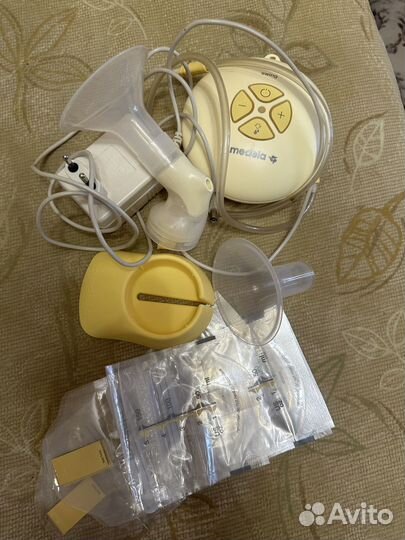 Молокоотсос medela