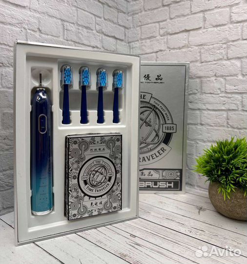 Электрическая зубная щетка