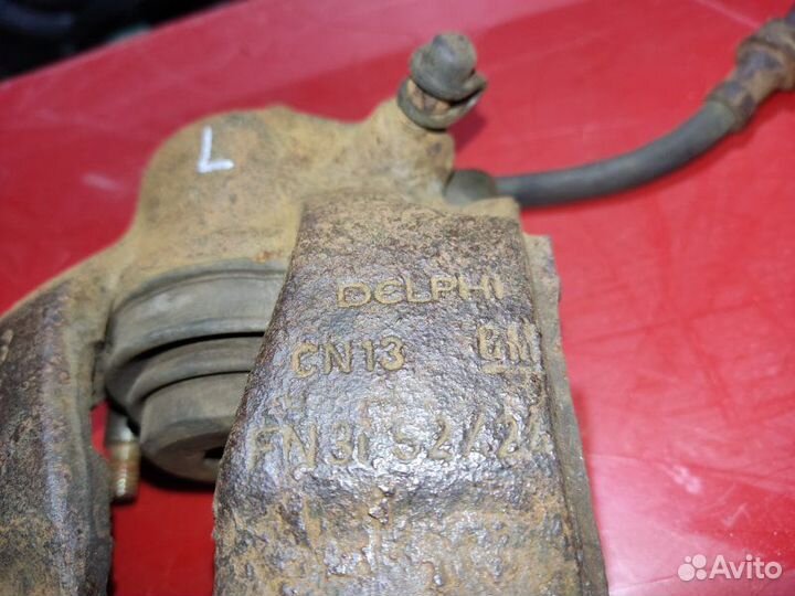 Суппорт тормозной передний левый Opel Astra G