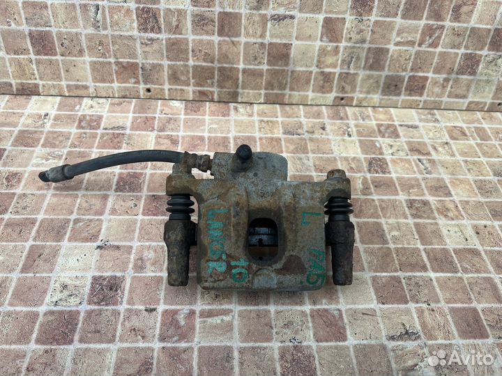 Задний левый суппорт на Mitsubishi Lancer 10