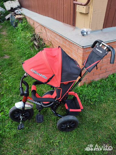 Трехколесный велосипед с ручкой