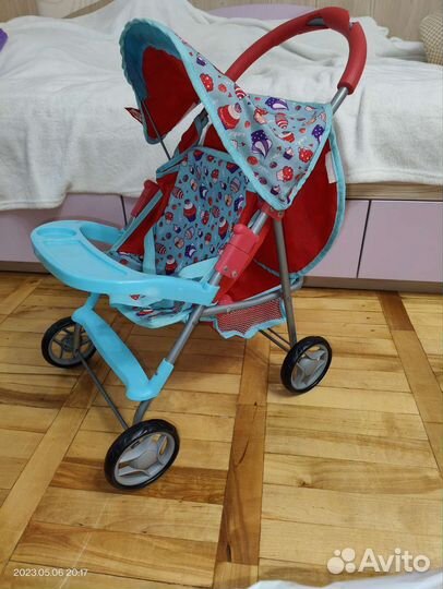 Пакетом Коляска д/кукол + куклы + игрушки + книги