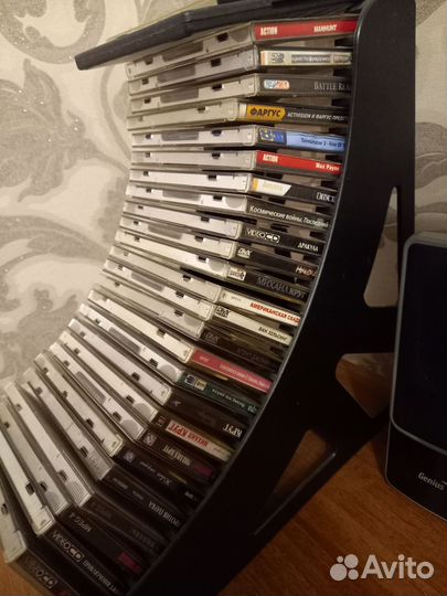 Двд диски с фильмами,играми,музыкой со стойкой