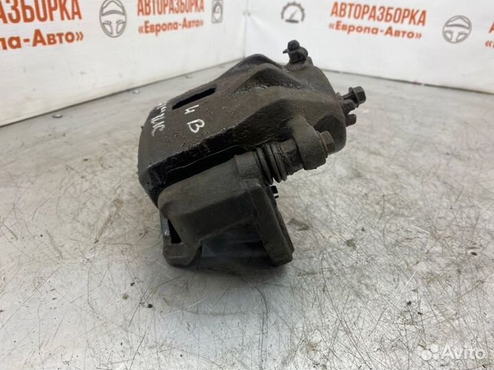 Суппорт тормозной передний левый Kia Magentis 2