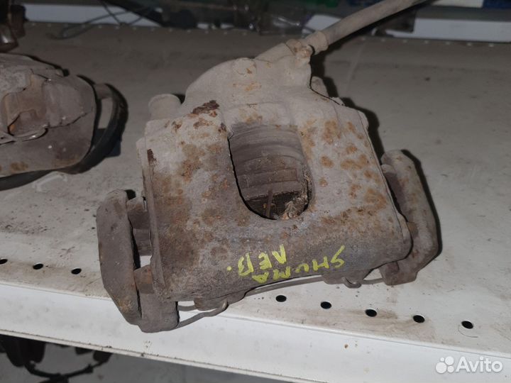 Суппорт тормозной Киа shuma R.L