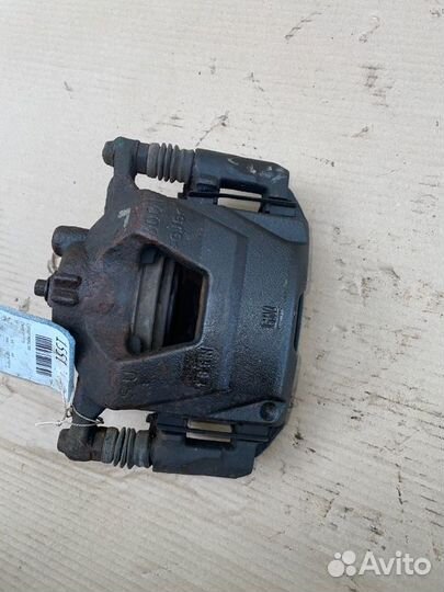 Суппорт тормозной передний левый Chevrolet Cruze