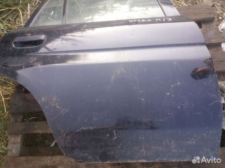 Двери Мазда демио