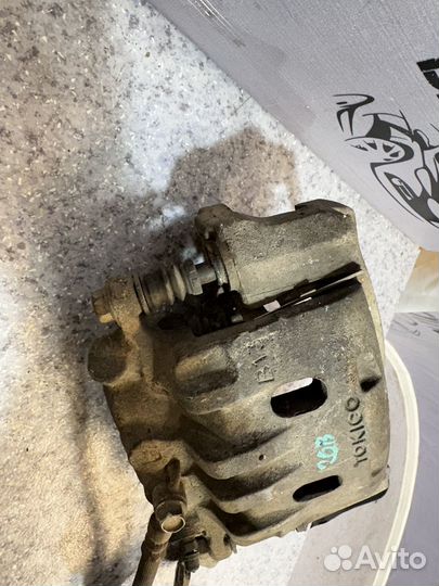 Суппорт передний левый Tociko