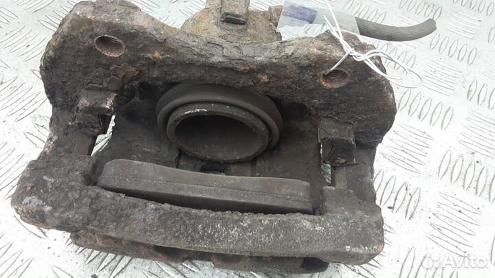 Суппорт передний левый Nissan Almera N16 рест