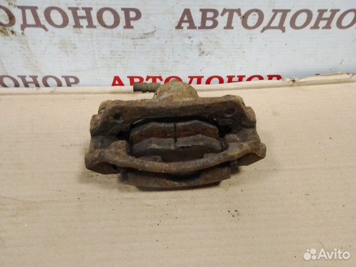 Суппорт тормозной передний левый Toyota Yaris