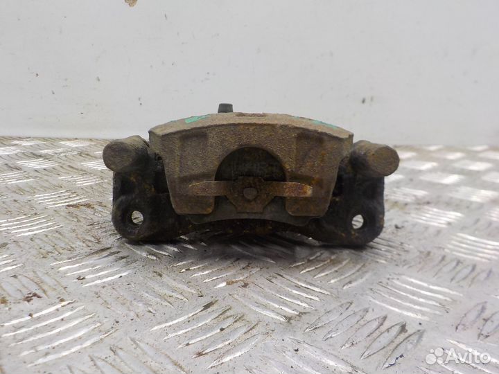 Суппорт тормозной задний левый Mitsubishi Lancer X