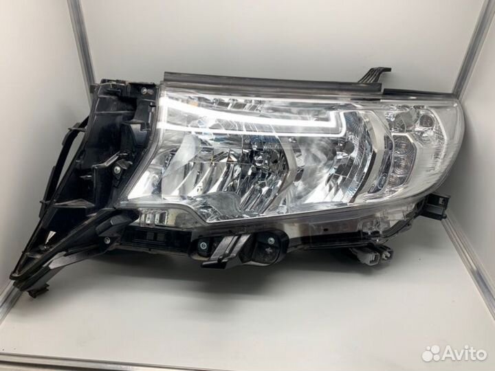 Фара галогеновая передняя левая Toyota Land