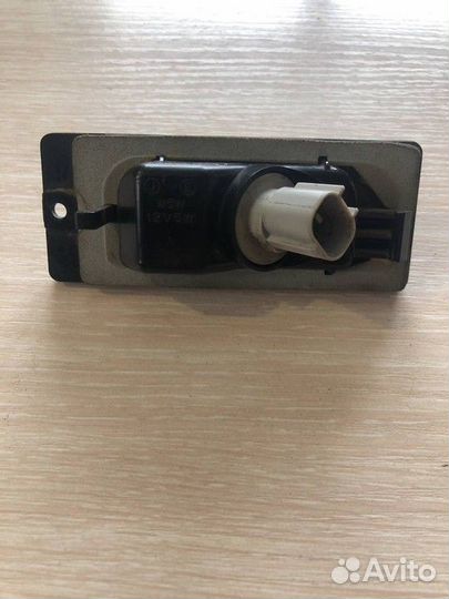 Фонарь подсветки номера Mitsubishi Lancer