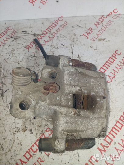 Суппорт тормозной задний правый Mazda 3 Bl седан