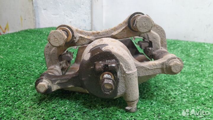 Суппорт передний левый Nissan Almera Classic 1.6