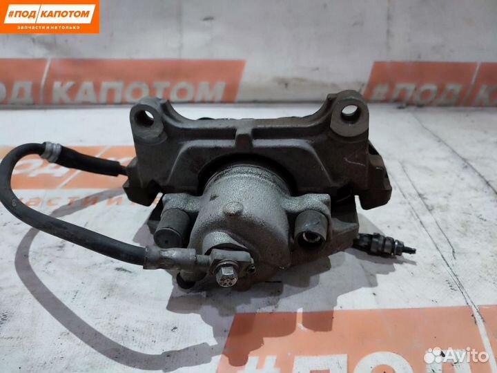 Суппорт тормозной передний левый Volkswagen Passat