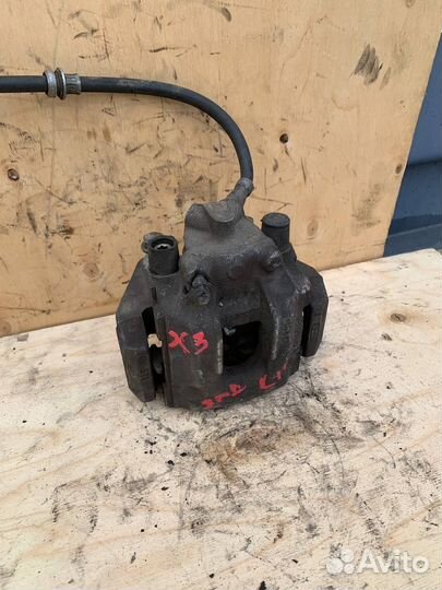 Левый задний тормозной суппорт BMW X3 E83